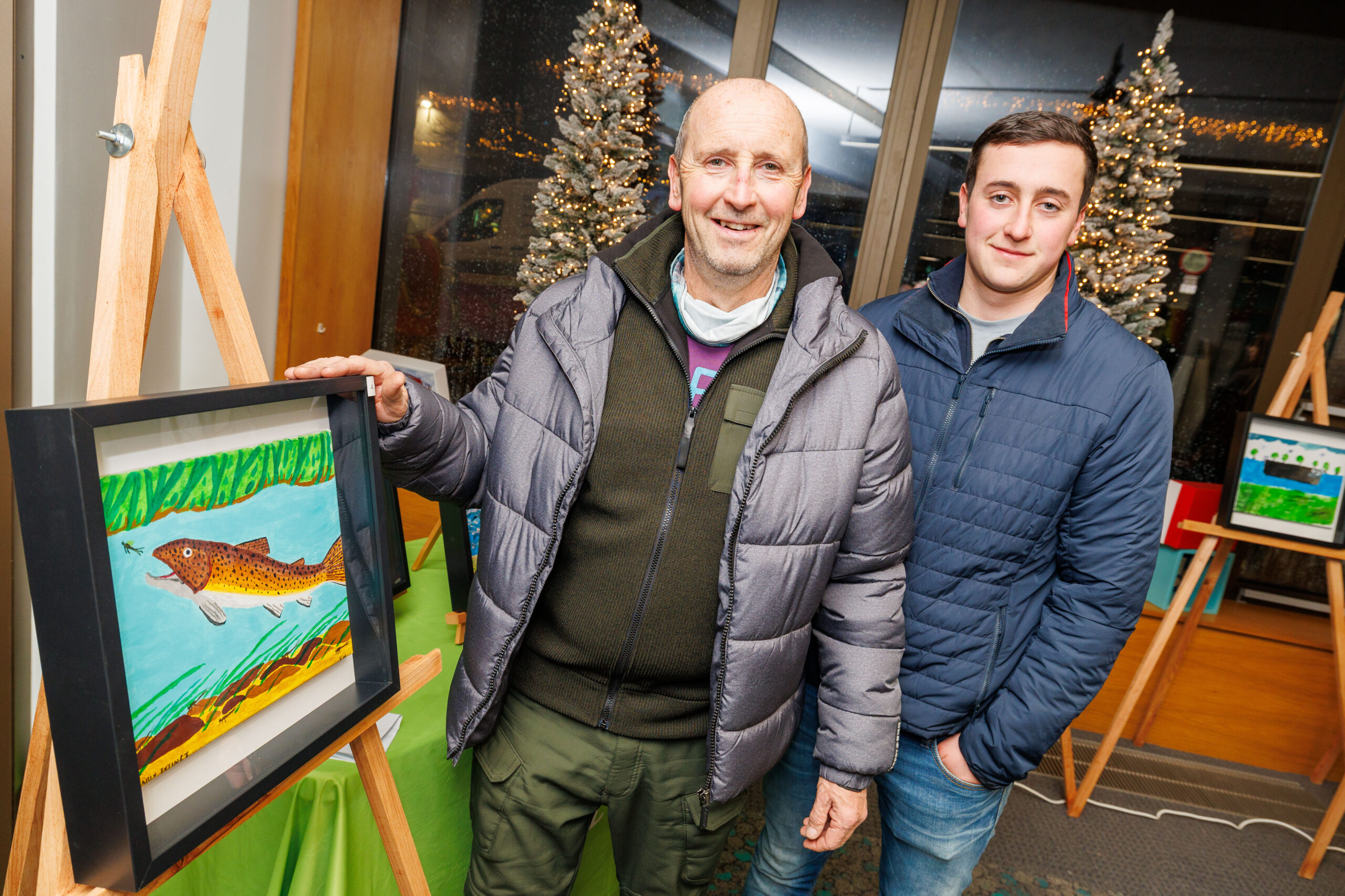 Niall Whiteley with one of two pieces and his son Caelán at Portlaoise Library for the launch of an exhibition showcasing artwork created through a collaborative project between LOETB Community Education and the B. Braun Dialysis Unit in Portlaoise.