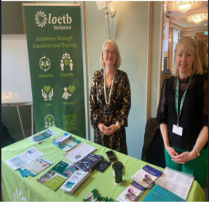 LOETB Inclusion Stand at NCSE event:  In this photo:  Thérèse Glennon, LOETB FET Access Officer, and Eileen Dunne (Inclusion FET Manager) are standing at a table with brochures of LOETB services.  Behind them is the a stand-up banner for LOETB Inclusion. 